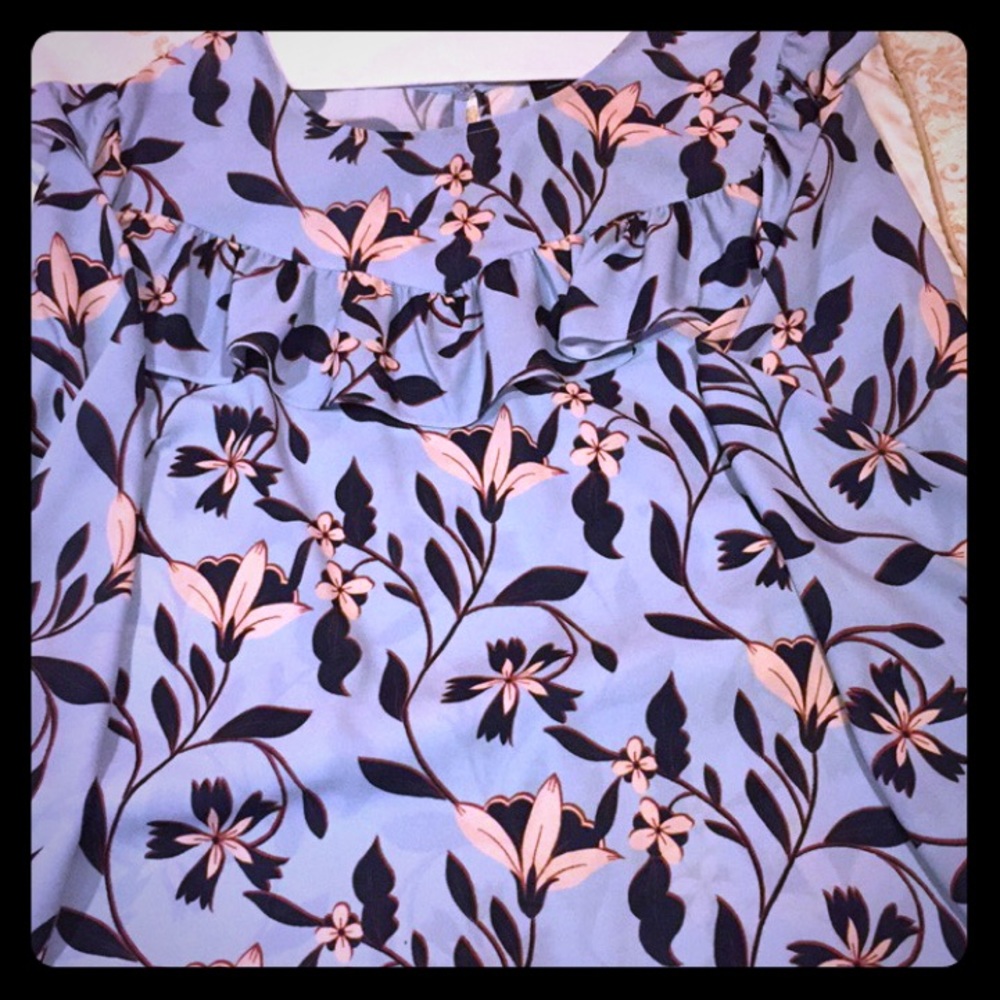 Eloquii Light blue blouse with floral print.